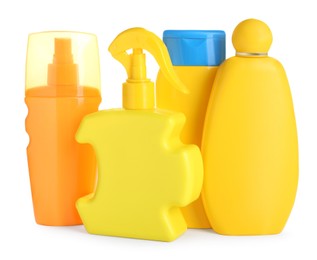 Photo of Many different suntan products on white background