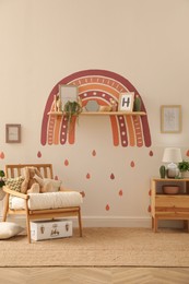 Photo of Child's room interior with rainbow painting on wall