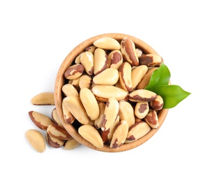 Photo of Brazil nuts in wooden bowl on white background, top view