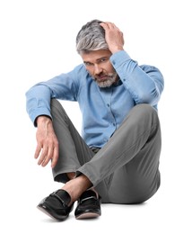 Photo of Mature businessman in stylish clothes sitting on white background
