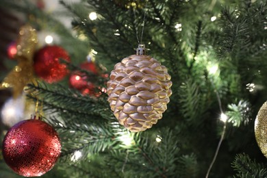 Photo of Beautifully decorated Christmas tree with bauble, closeup