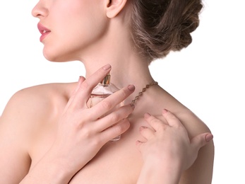 Photo of Beautiful young woman with bottle of perfume on white background, closeup