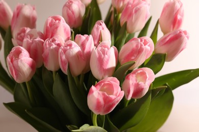 Photo of Beautiful bouquet of fresh pink tulips on blurred background, closeup
