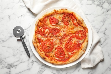 Photo of Hot cheese pizza Margherita on marble table, top view