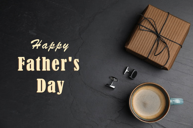 Image of Cup of coffee, gift box and cuff links on black table, flat lay. Happy father's day