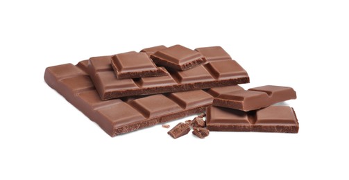 Photo of Pieces of delicious milk chocolate bars on white background