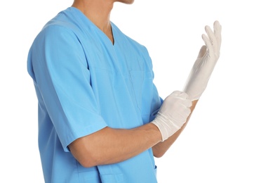 Photo of Male doctor putting on rubber gloves against white background. Medical object