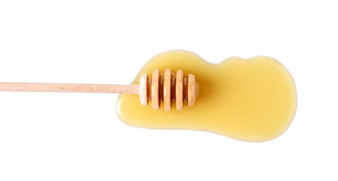 Photo of Wooden dipper and fresh honey on white background, top view