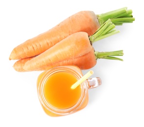 Photo of Freshly made carrot juice in mason jar on white background, top view