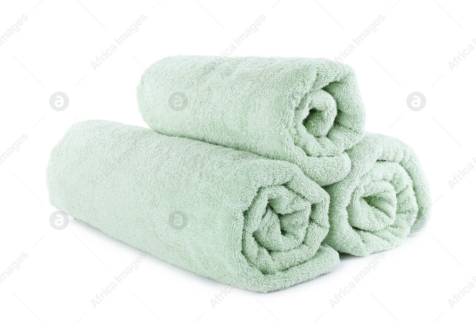 Photo of Fresh rolled light towels isolated on white