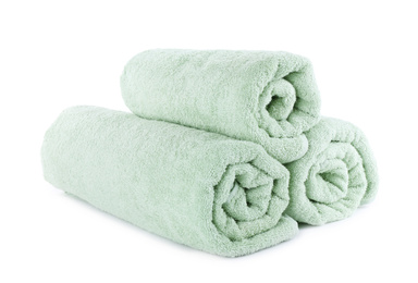 Photo of Fresh rolled light towels isolated on white