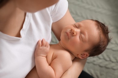 Photo of Mother holding her cute newborn baby, closeup