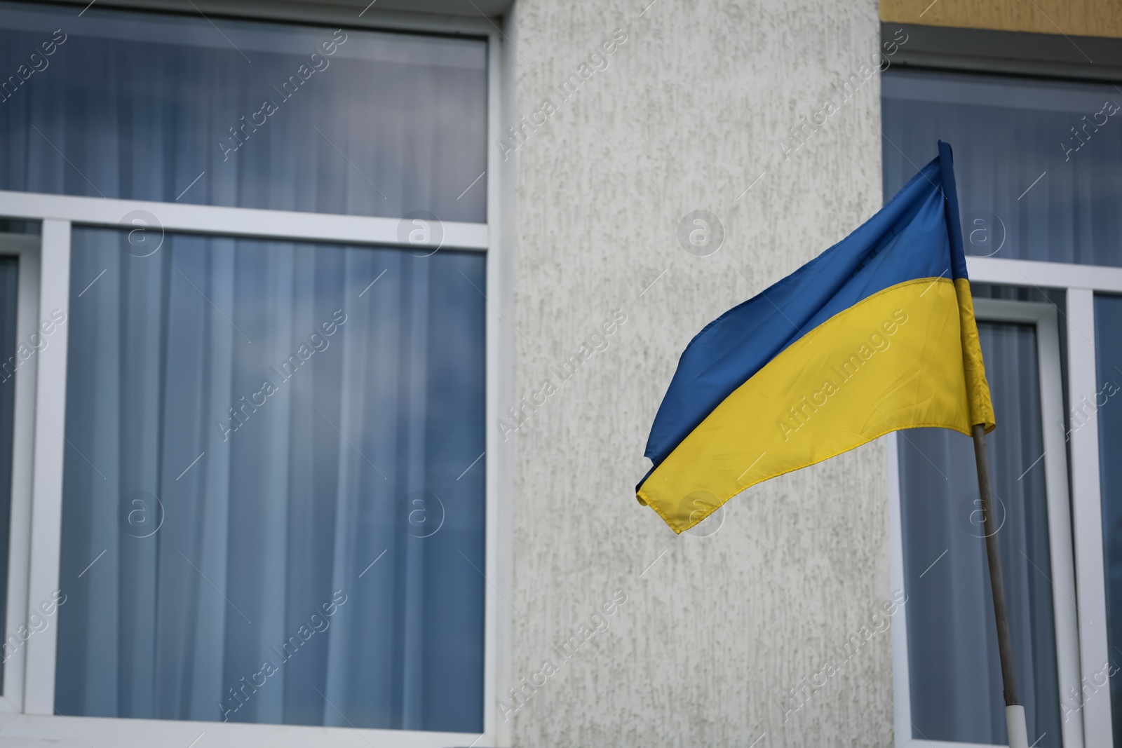 Photo of National flag of Ukraine on building facade