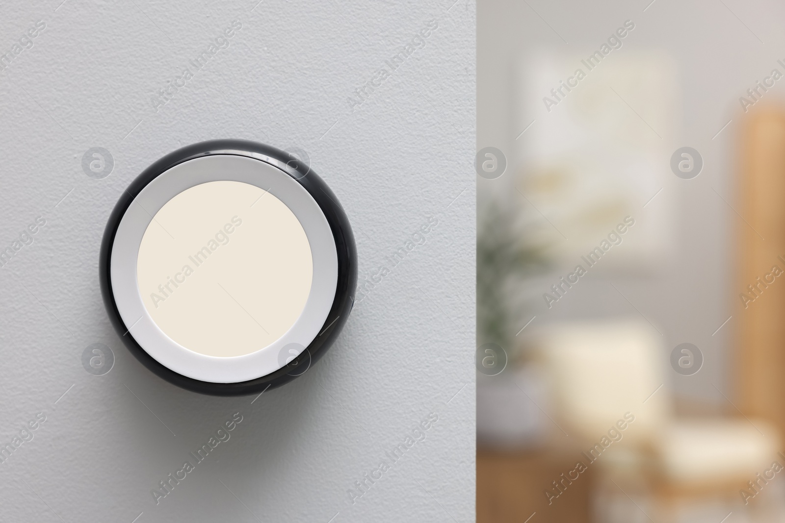 Photo of One thermostat on white wall indoors, space for text. Smart home system