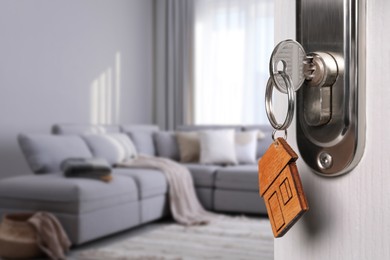 Image of Closeup view of door with key open in living room 