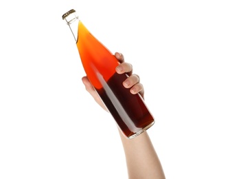 Photo of Woman holding bottle of delicious kvass on white background, closeup