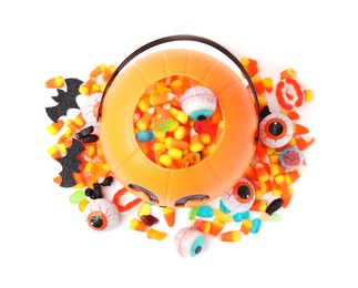 Photo of Halloween trick or treat bucket with different sweets on white background, top view