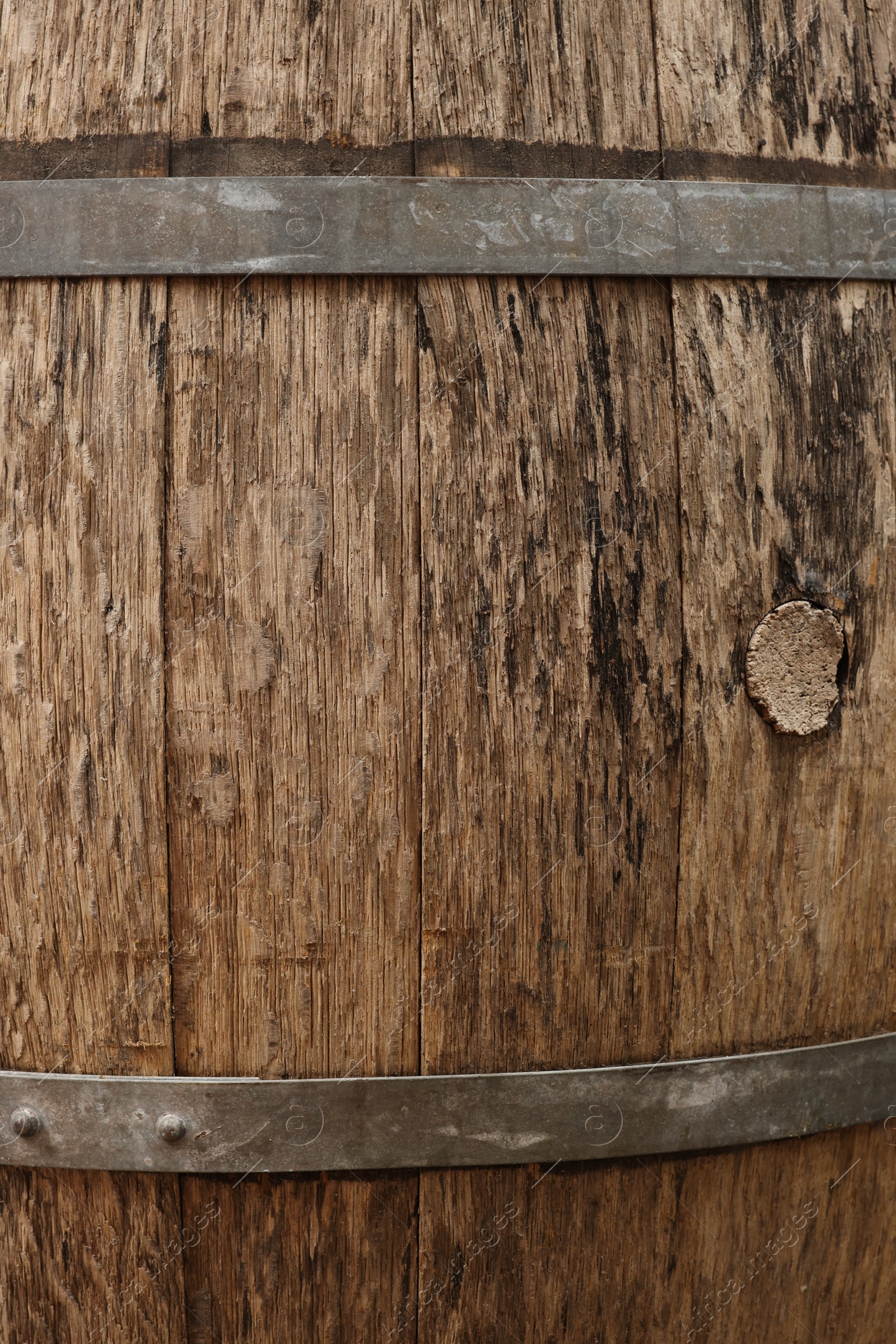 Photo of Traditional wooden barrel as background, closeup. Wine making