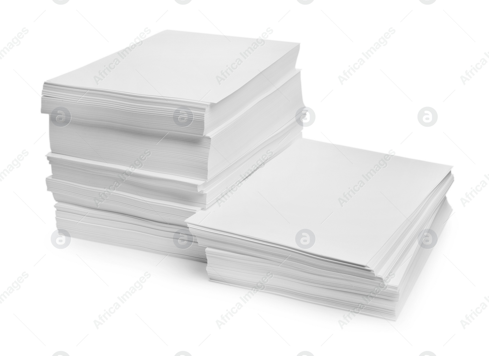 Photo of Stacks of paper sheets on white background