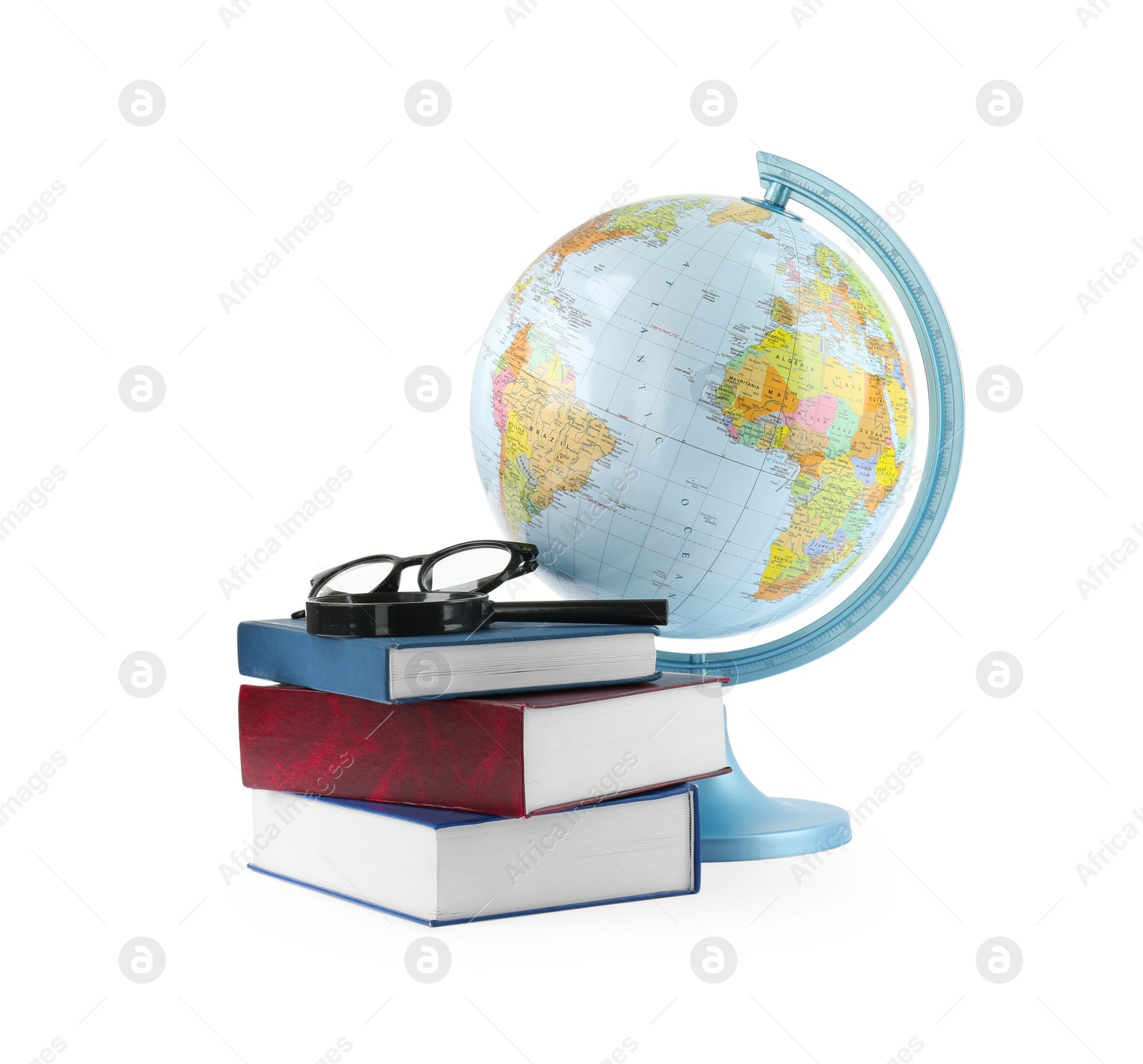 Photo of Plastic model globe of Earth, books and eyeglasses on white background. Geography lesson