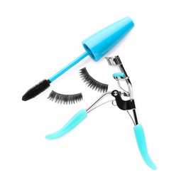 Fake eyelashes, curler and mascara on white background, top view