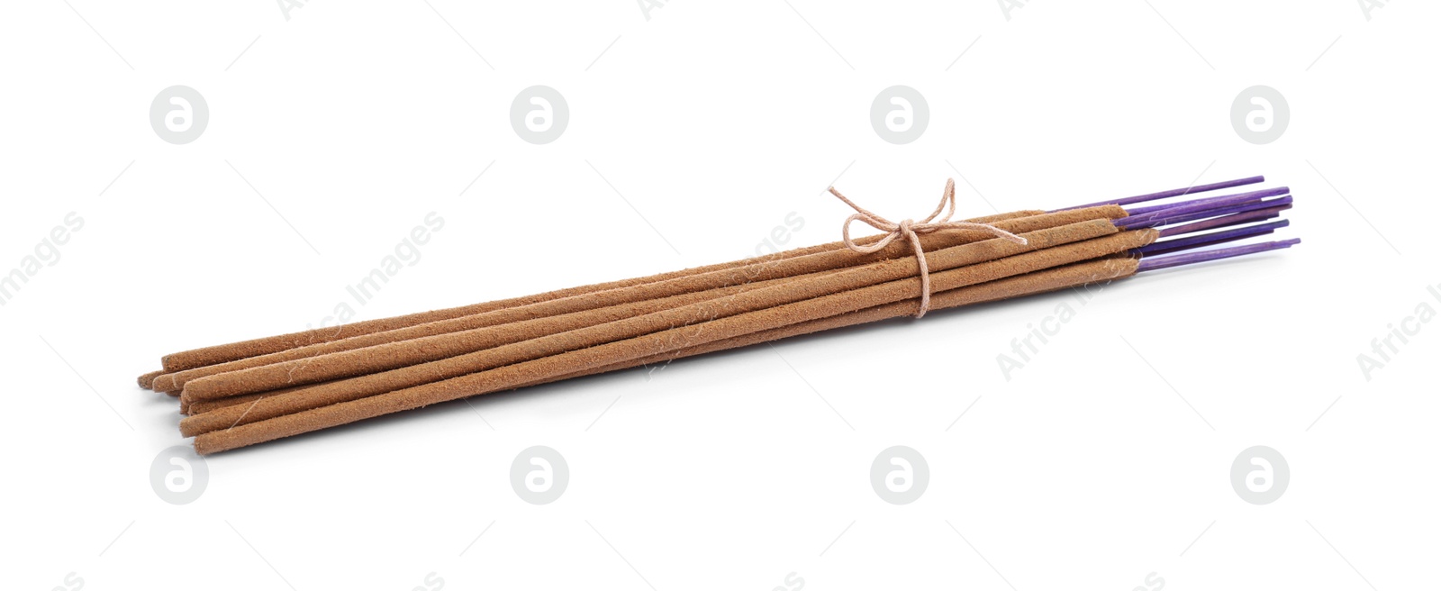 Photo of Many aromatic incense sticks tied with twine on white background