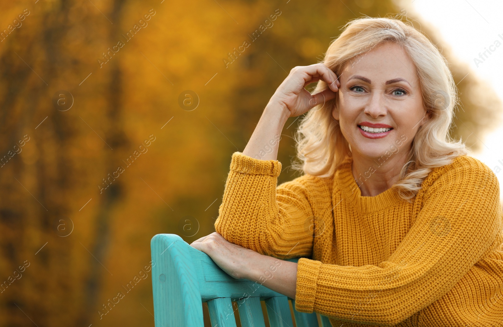 Photo of Portrait of happy mature woman in park