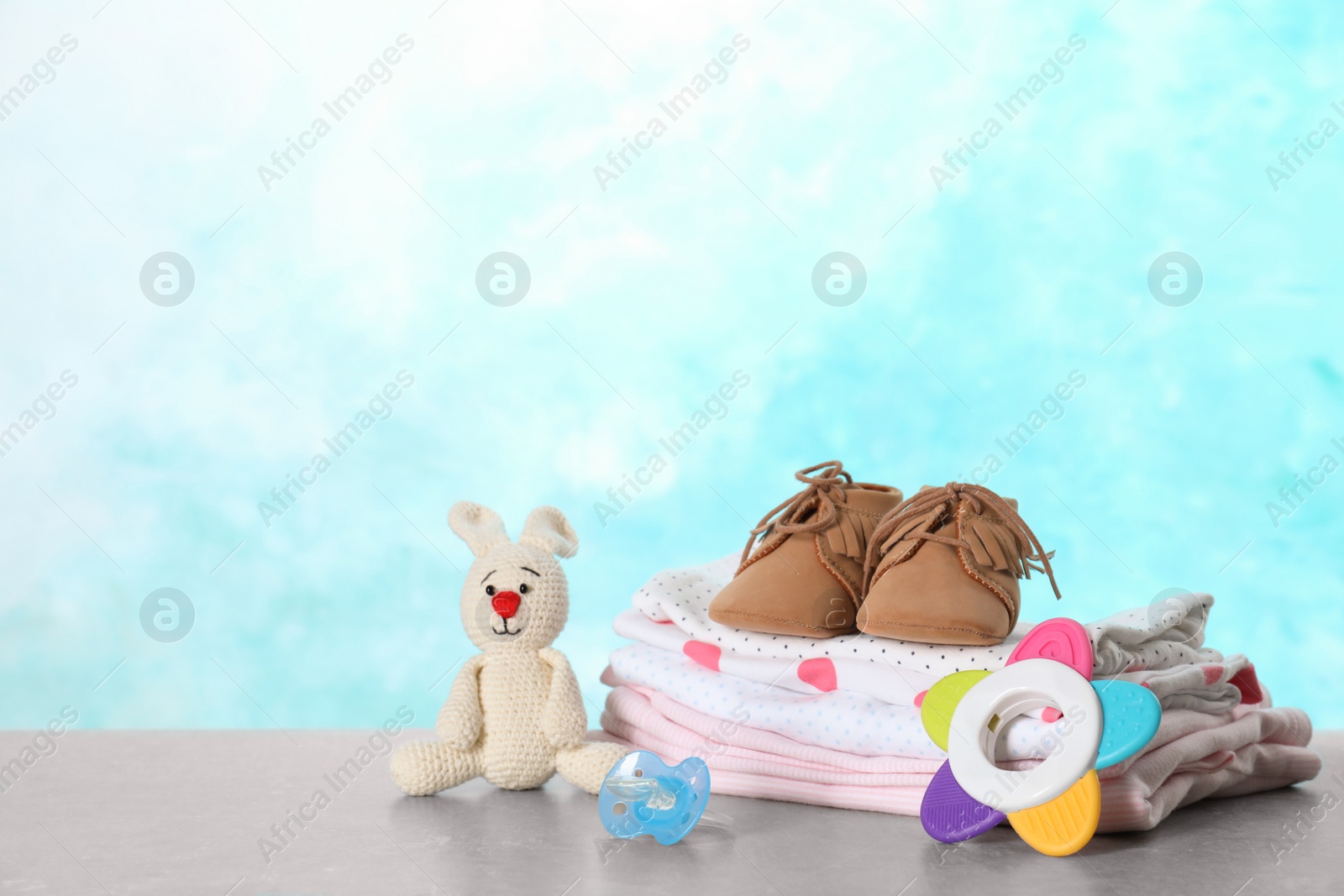 Photo of Set of different baby accessories and toys on table. Space for text