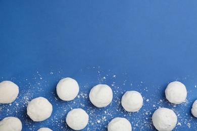 Photo of Snowballs on blue background, flat lay. Space for text
