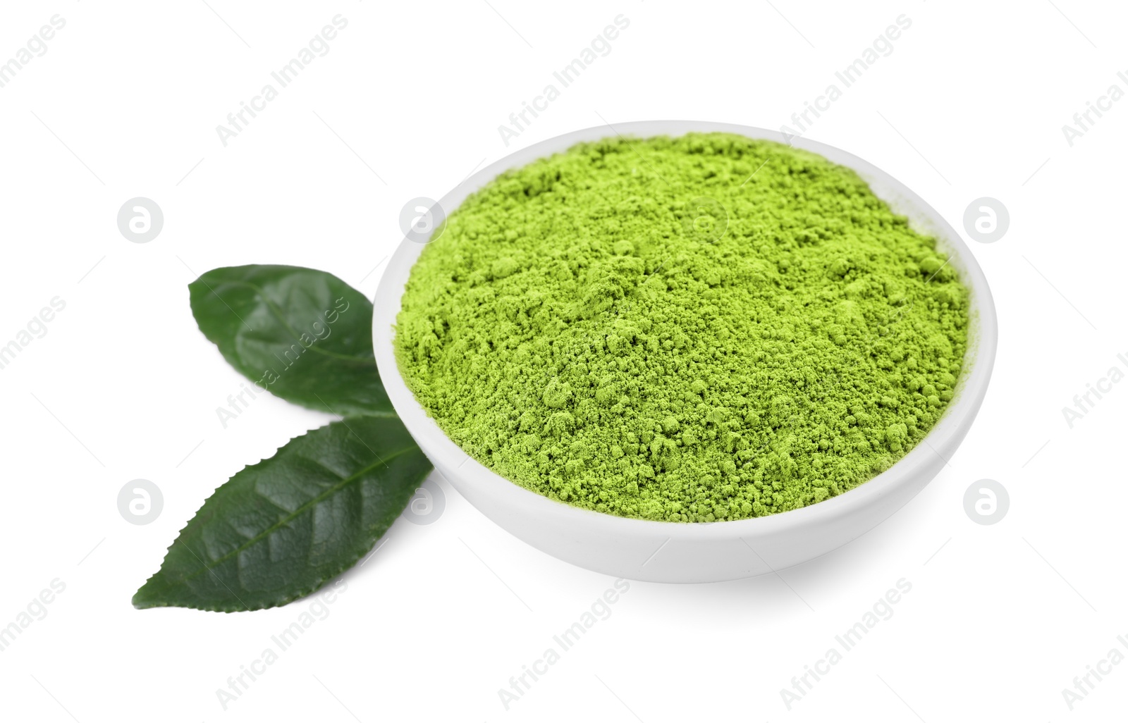 Photo of Leaves and bowl of matcha powder isolated on white