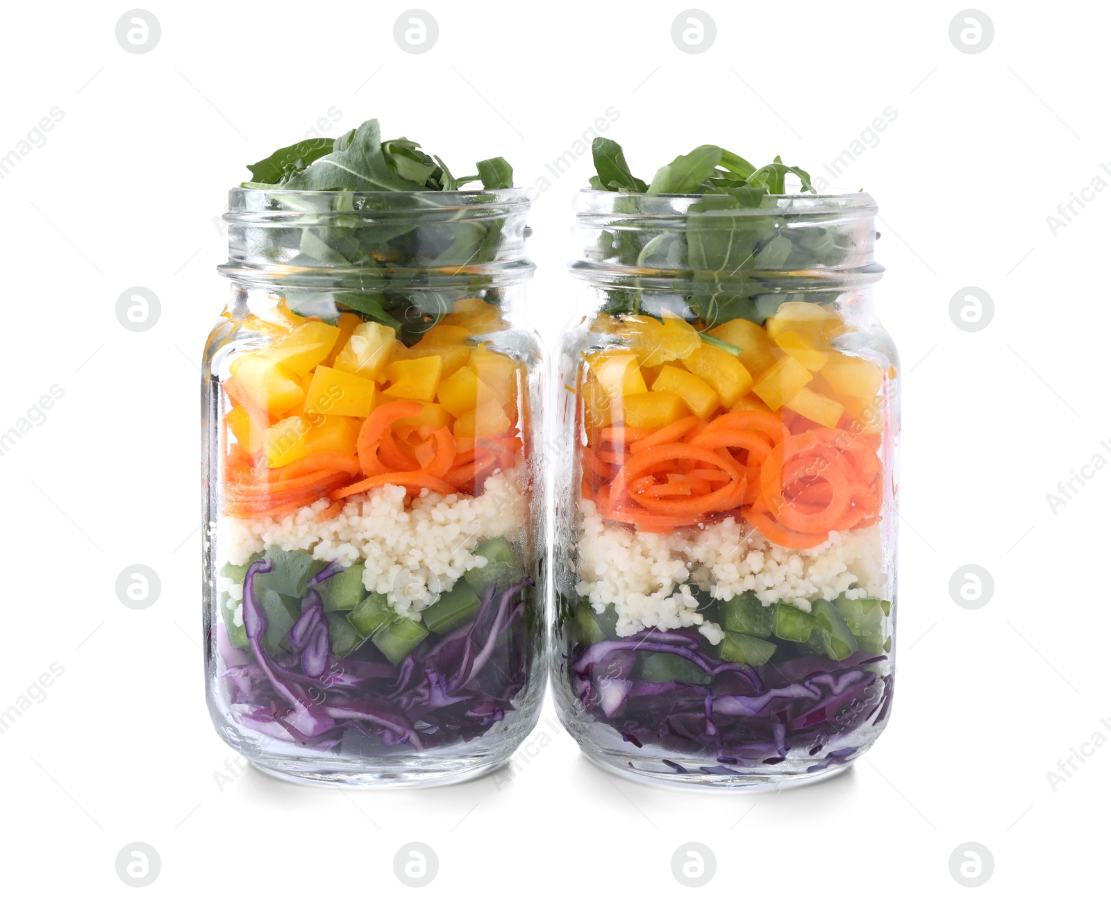 Photo of Healthy salad in glass jars isolated on white