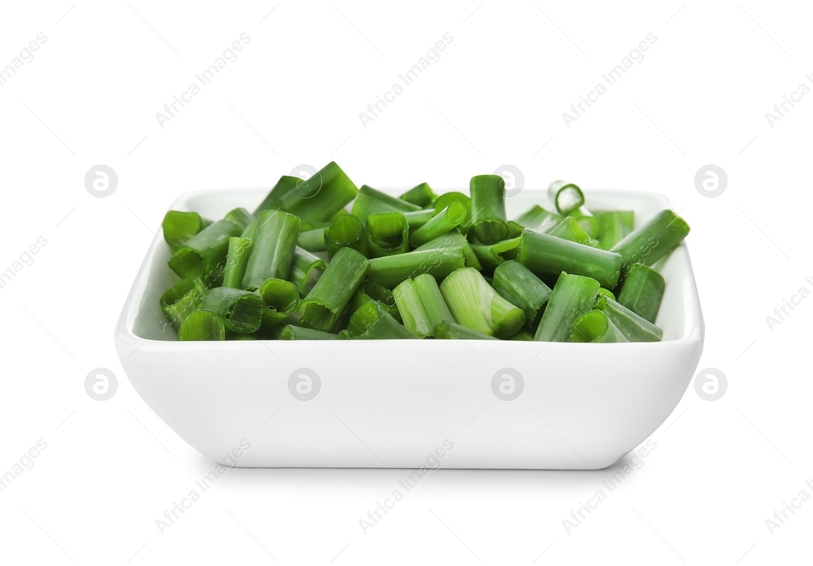 Photo of Bowl with chopped green onion on white background