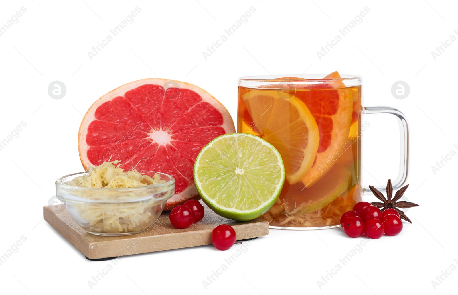 Photo of Glass cup of immunity boosting drink and ingredients on white background