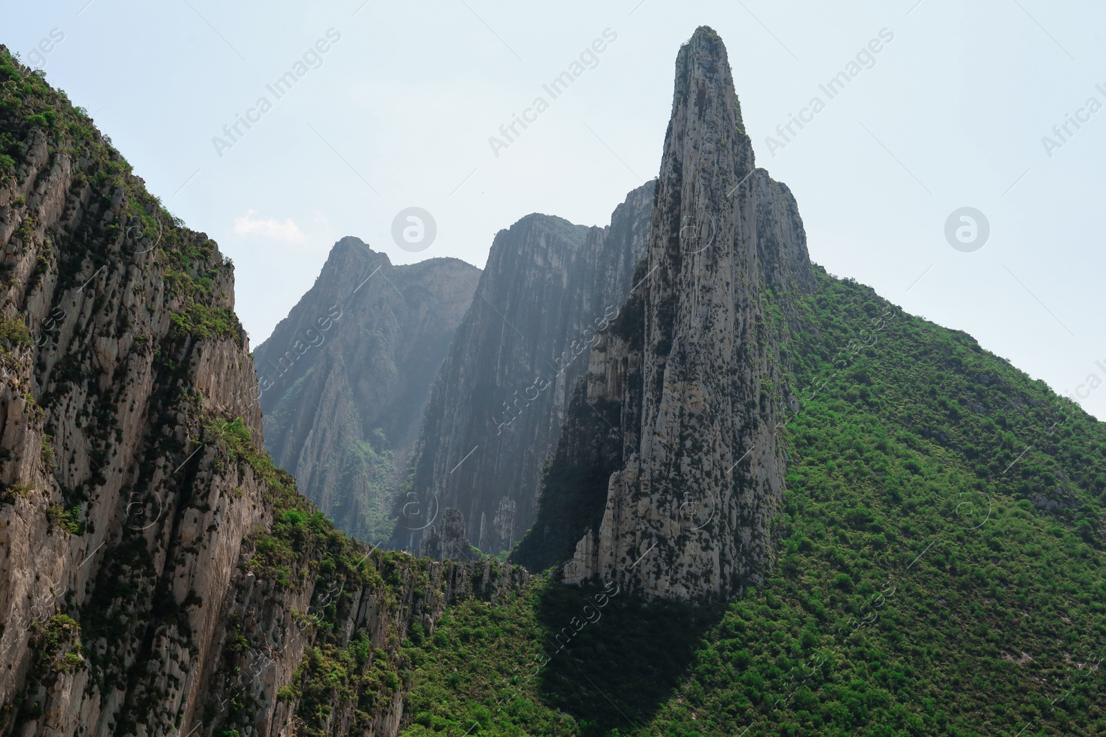 Photo of Picturesque landscape with high mountains under blue sky outdoors