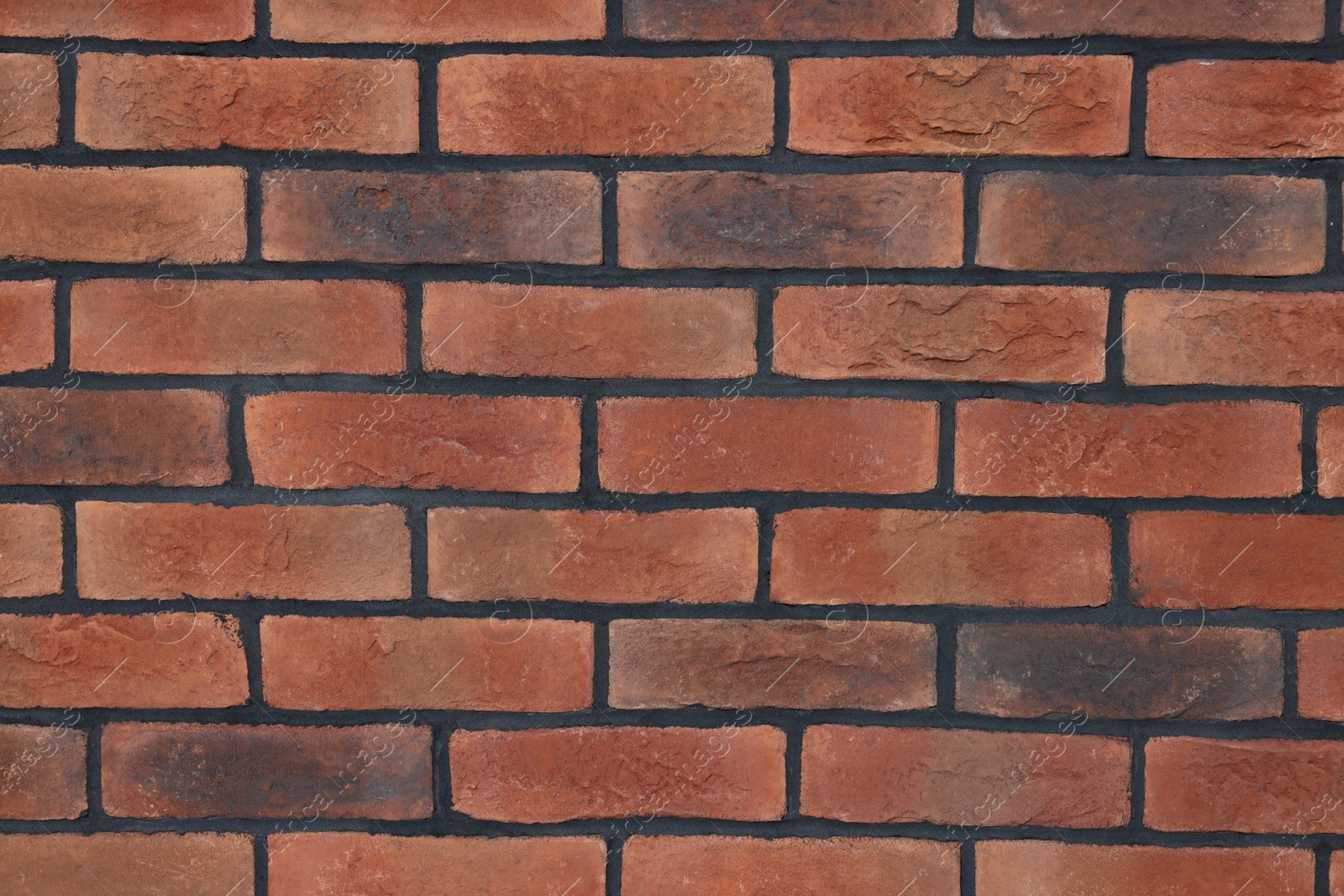 Photo of Decorative bricks on repaired wall as background, closeup