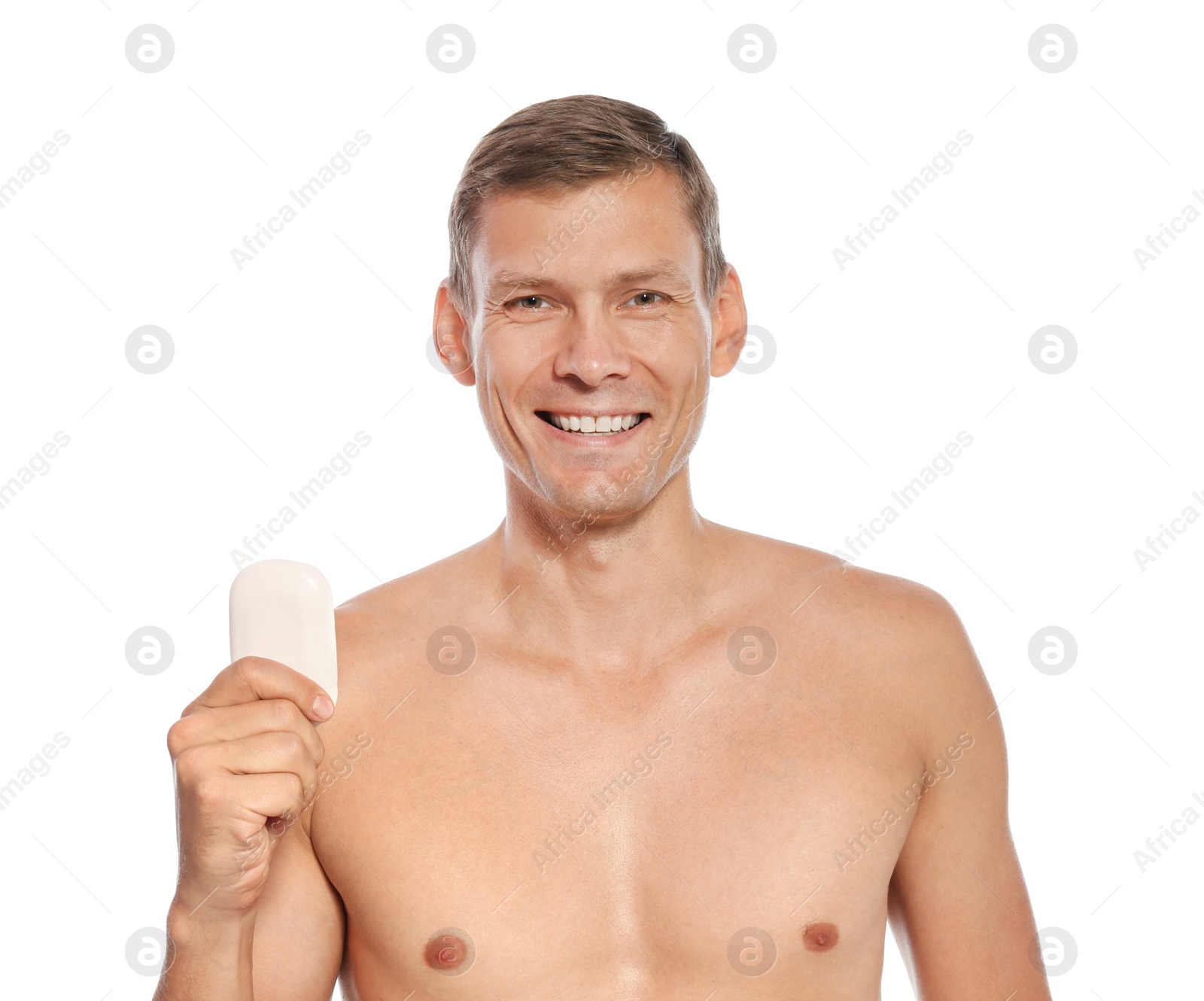 Photo of Portrait of man holding soap bar on white background