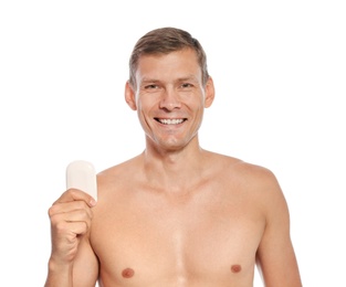 Photo of Portrait of man holding soap bar on white background