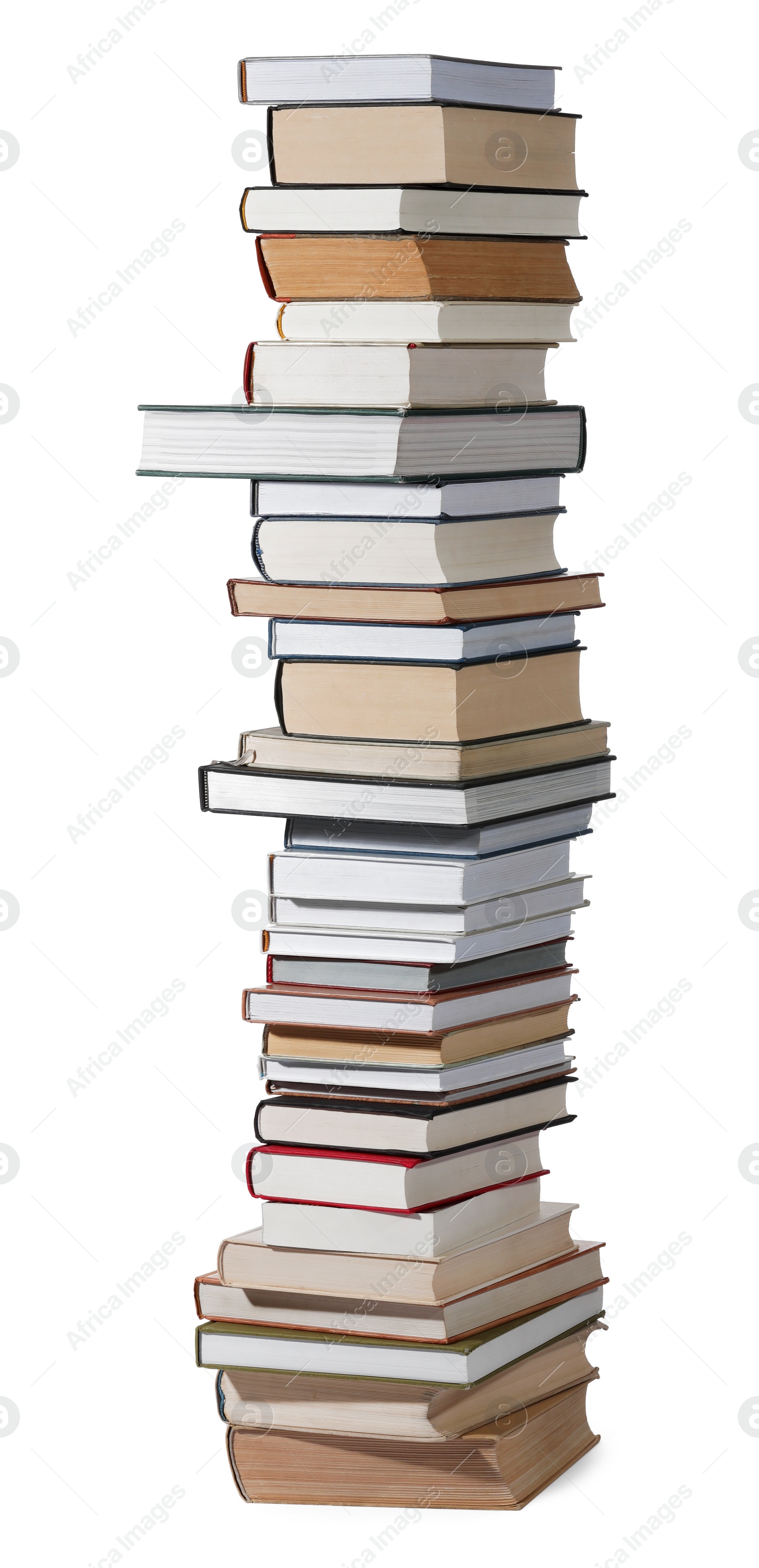 Photo of High stack of many different books isolated on white