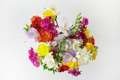 Beautiful spring freesia flowers isolated on white, top view