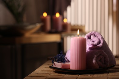 Photo of Beautiful composition with different spa products on wicker bench indoors, space for text