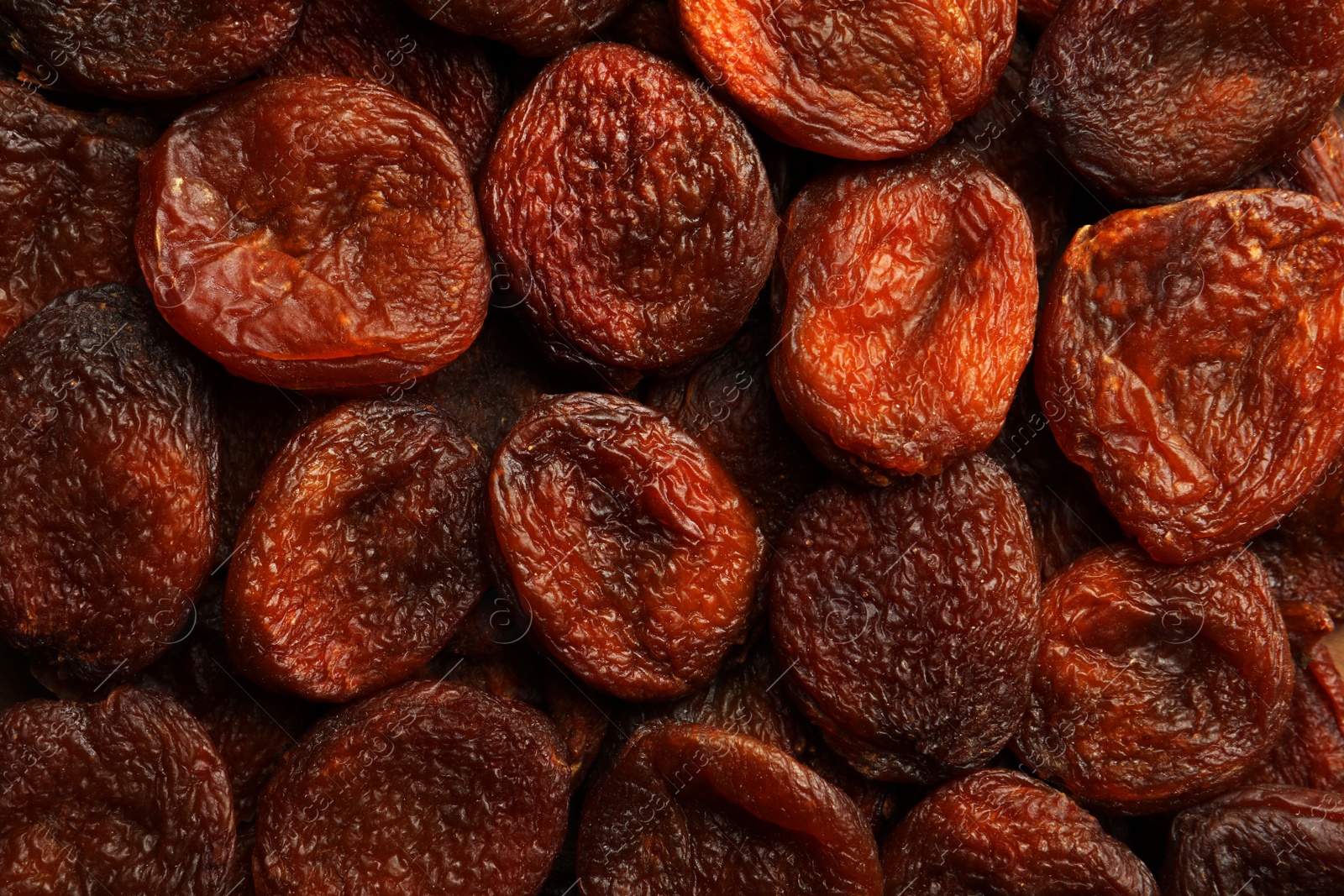 Photo of Tasty dried apricots as background, top view. Healthy snack