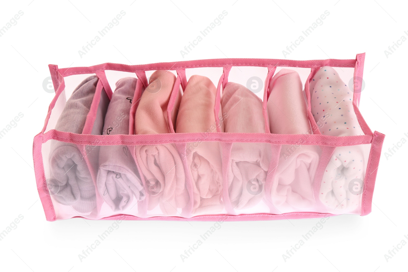 Photo of Transparent organizer with folded clothes isolated on white