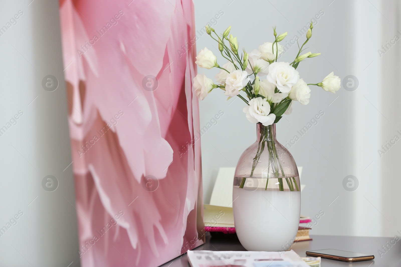 Photo of Composition of stylish vase with fresh flowers on grey table indoors