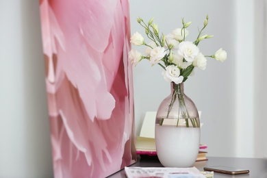 Composition of stylish vase with fresh flowers on grey table indoors