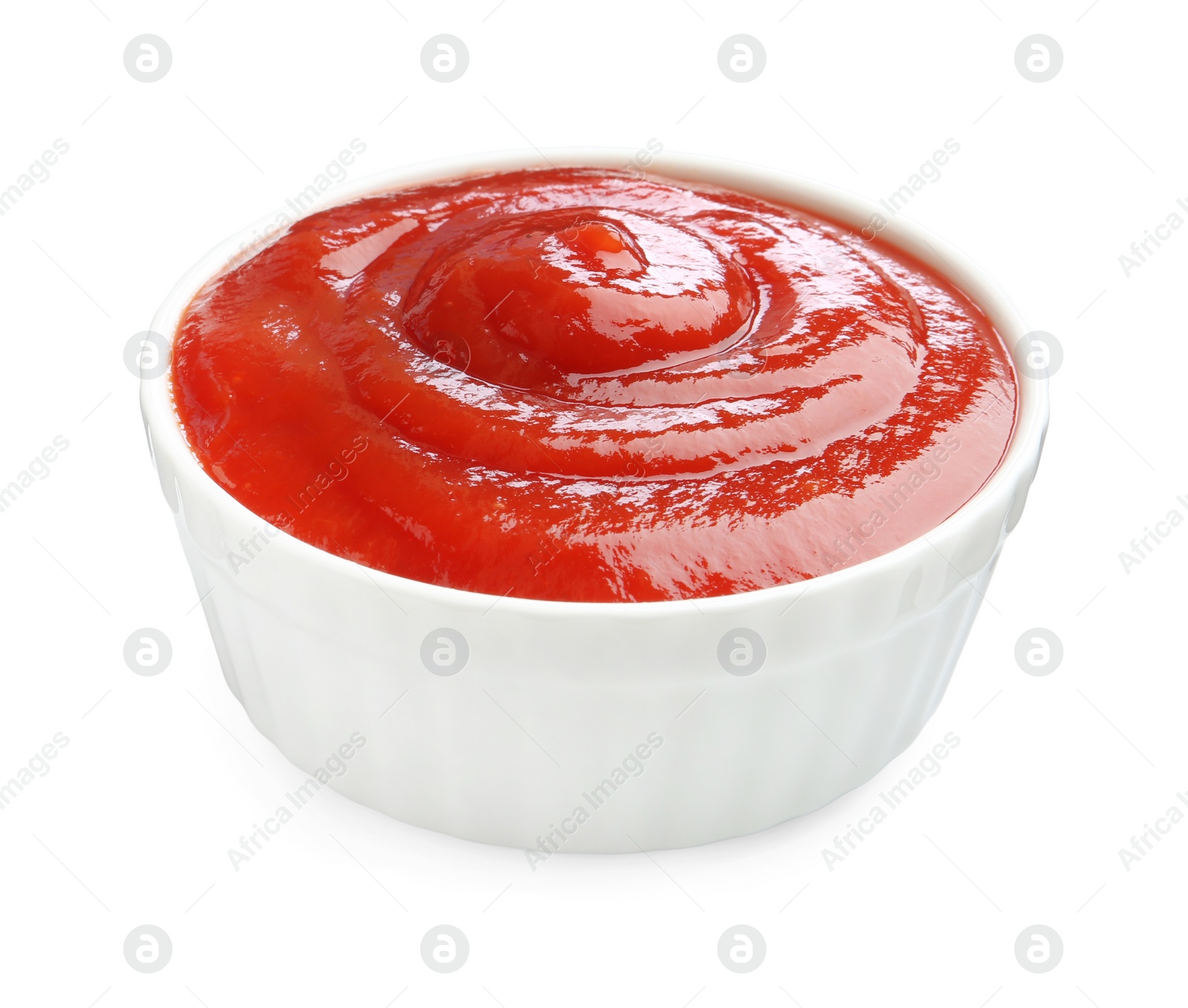 Photo of Tasty ketchup in bowl isolated on white. Tomato sauce