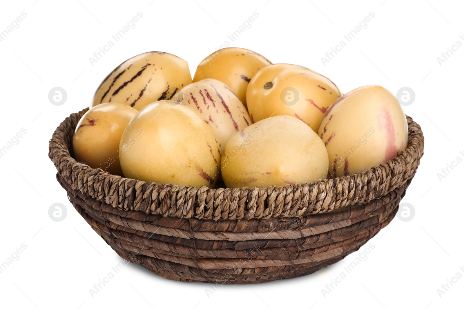 Photo of Fresh ripe pepino melons in wicker bowl on white background