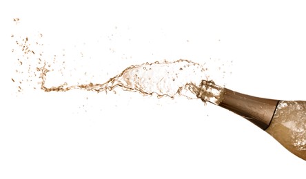Photo of Sparkling wine splashing out of bottle on white background