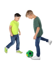 Photo of Little children playing soccer on white background. Indoor entertainment