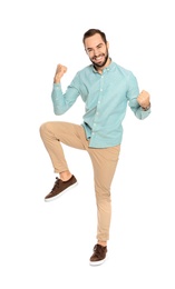 Photo of Young man celebrating victory on white background