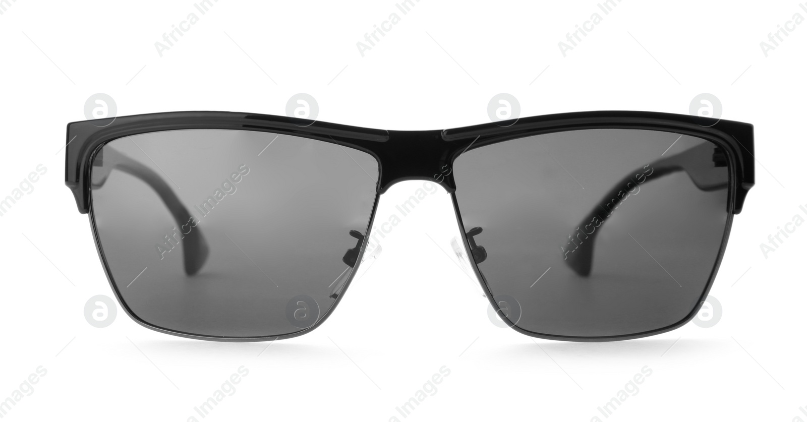 Photo of New stylish elegant sunglasses isolated on white